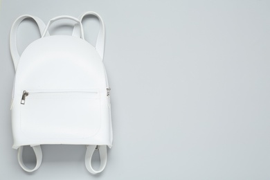 Stylish urban backpack on white background, top view