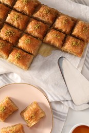 Delicious sweet baklava on table, flat lay