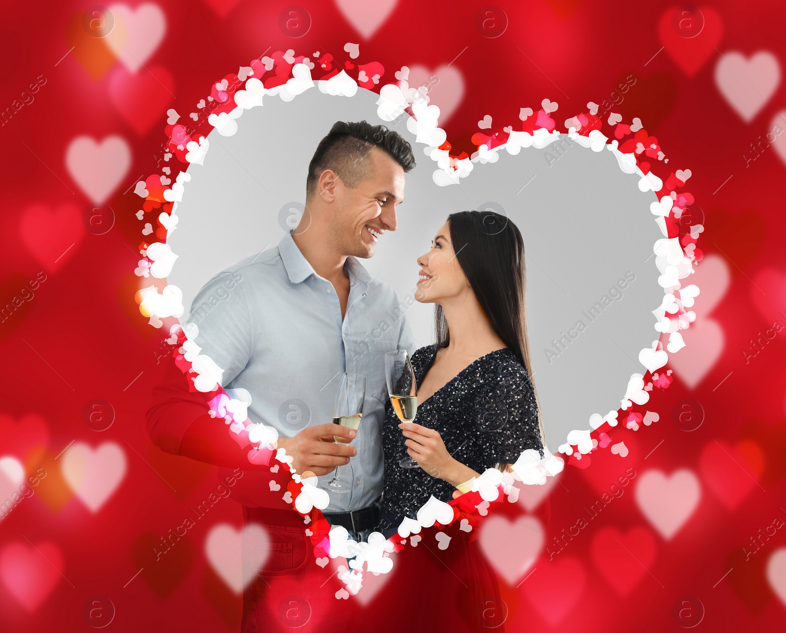 Image of Lovely young couple with glasses of champagne on light background. Valentine's day celebration