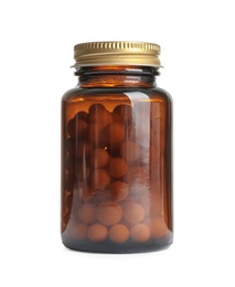 Bottle with vitamin pills on white background