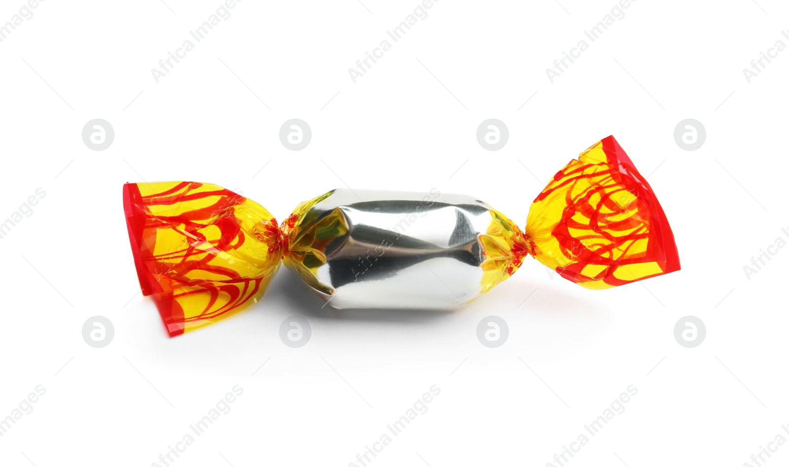 Photo of Delicious candy wrapped in foil on white background