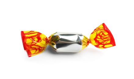 Delicious candy wrapped in foil on white background