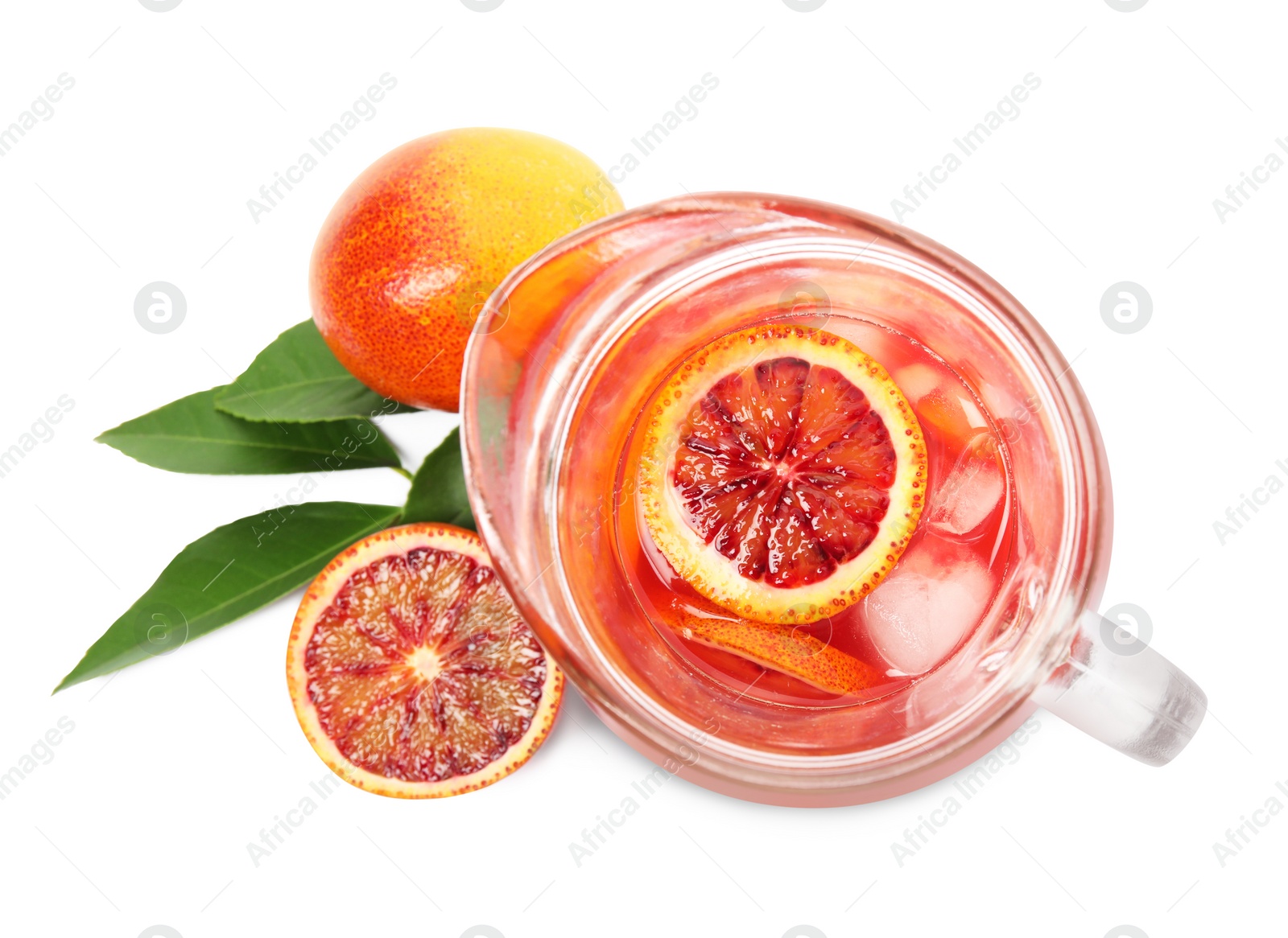Photo of Tasty sicilian orange juice with ice cubes in glass jug on white background, top view
