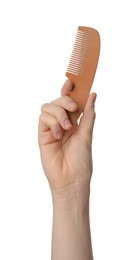 Photo of Woman holding bamboo hair comb on white background, closeup. Conscious consumption