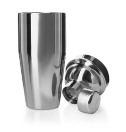 Photo of Metal cocktail shaker, strainer and cap isolated on white