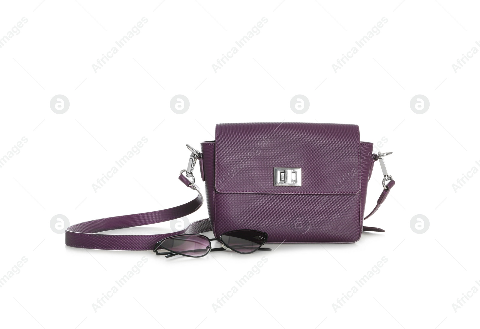 Photo of Stylish woman's bag and sunglasses isolated on white