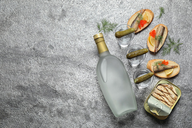 Photo of Flat lay composition with cold Russian vodka on grey table. Space for text