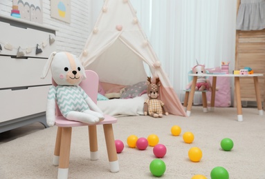 Cute child's room interior with toys and play tent