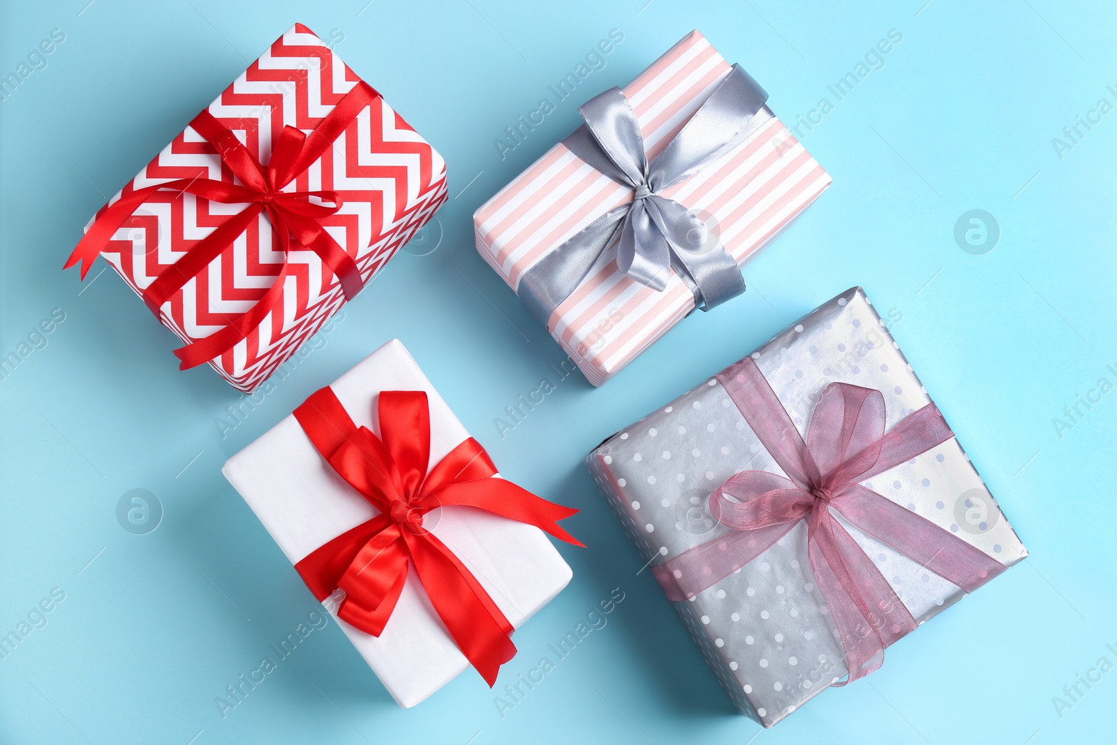 Photo of Different gift boxes on color background, flat lay