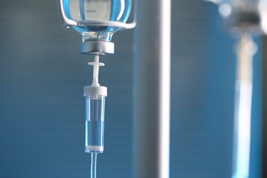 Photo of IV drip against blurred background, space for text