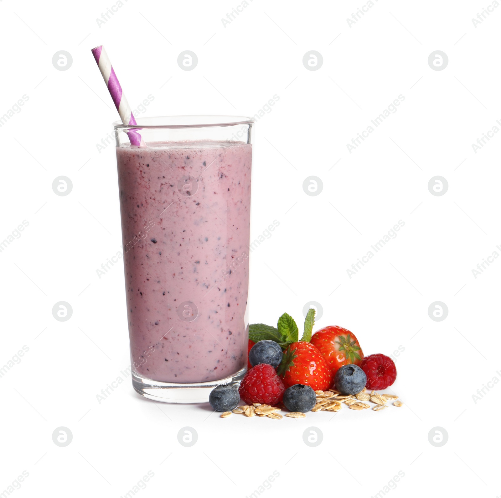 Photo of Glass of tasty smoothie with berries, mint and oatmeal on white background