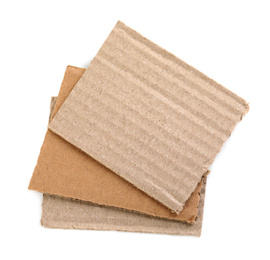 Photo of Pieces of brown cardboard isolated on white, top view