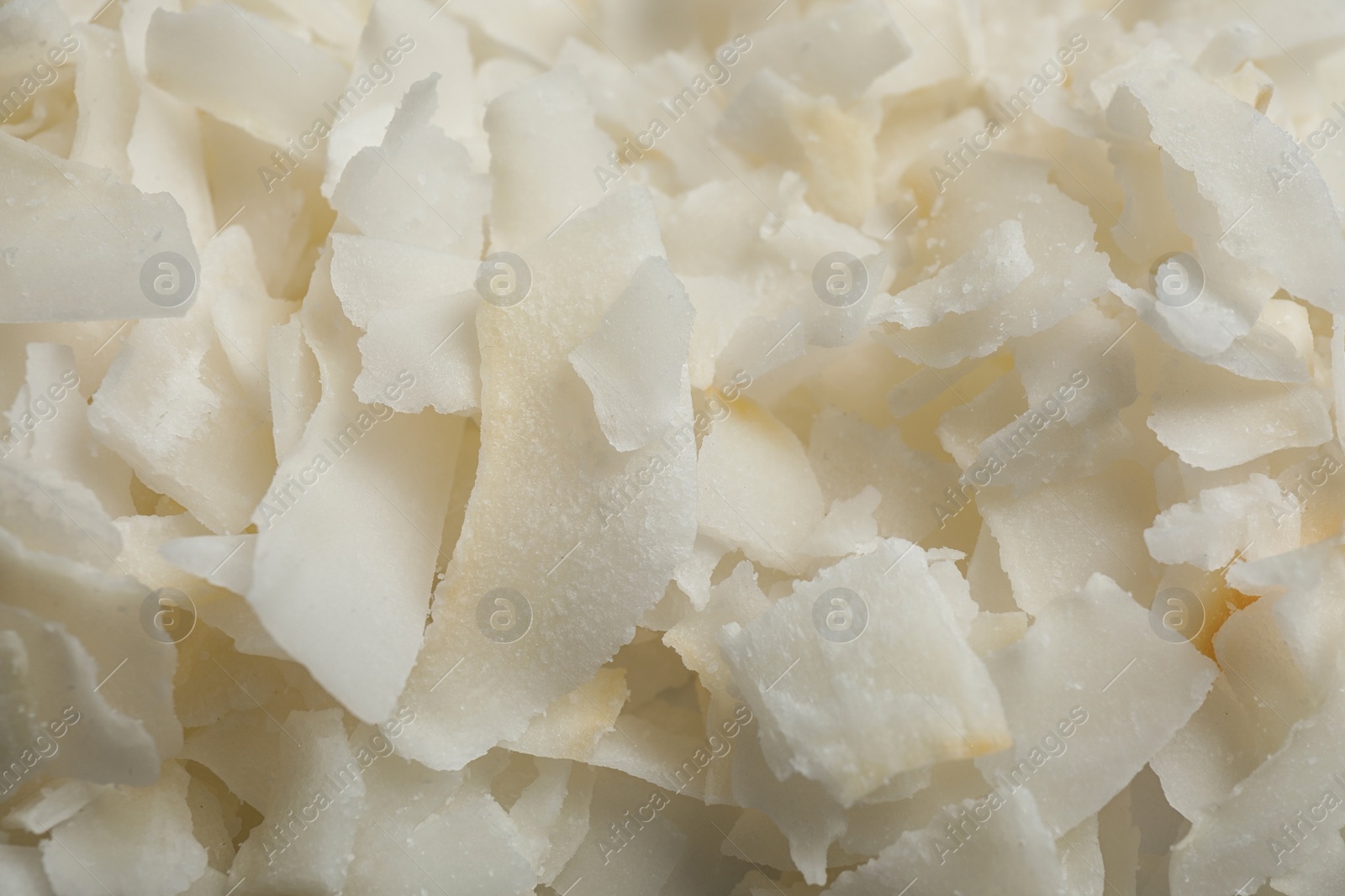 Photo of Delicious fresh coconut chips as background, closeup