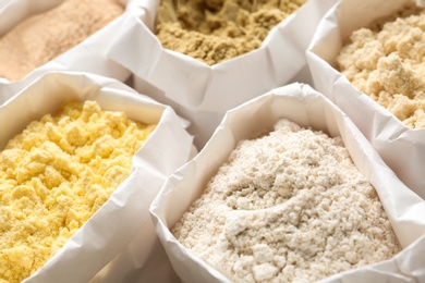 Photo of Different types of flour in paper bags