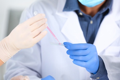 Scientists working in laboratory, closeup view. Research and analysis