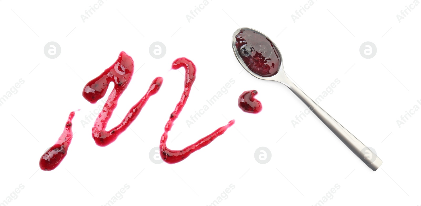 Photo of Tasty sweet jam and spoon isolated on white, top view