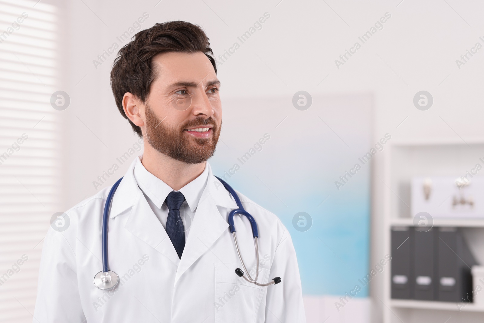 Photo of Medical consultant with stethoscope in clinic, space for text