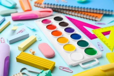 Photo of Different school stationery on light background, closeup. Back to school