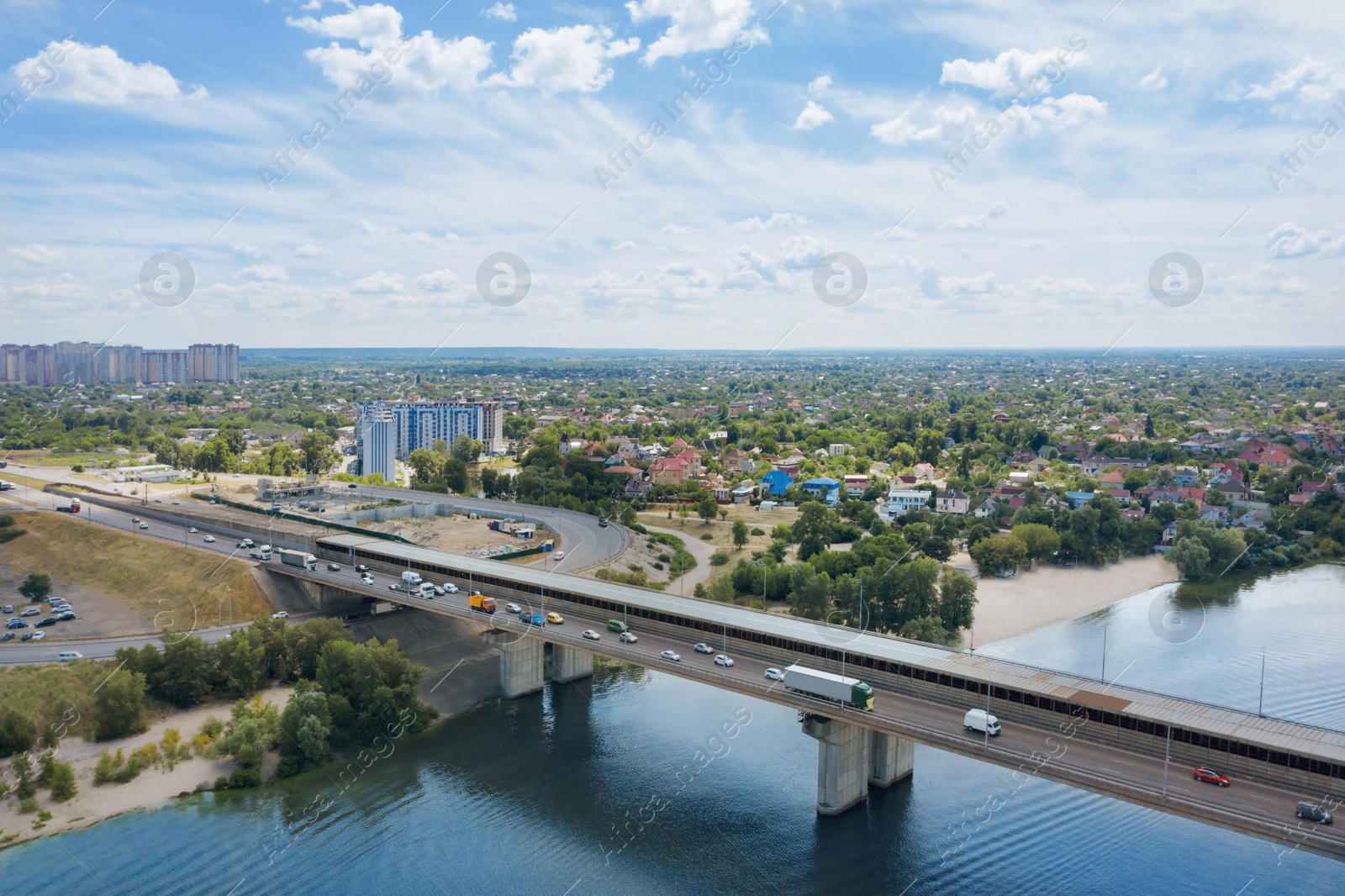 Image of Aerial view of modern bridge over river