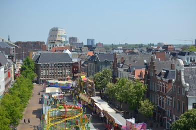 Photo of Many beautiful buildings and amusement park under blue sky