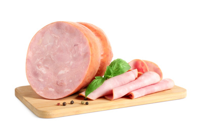 Tasty ham with basil and pepper on wooden board, white background