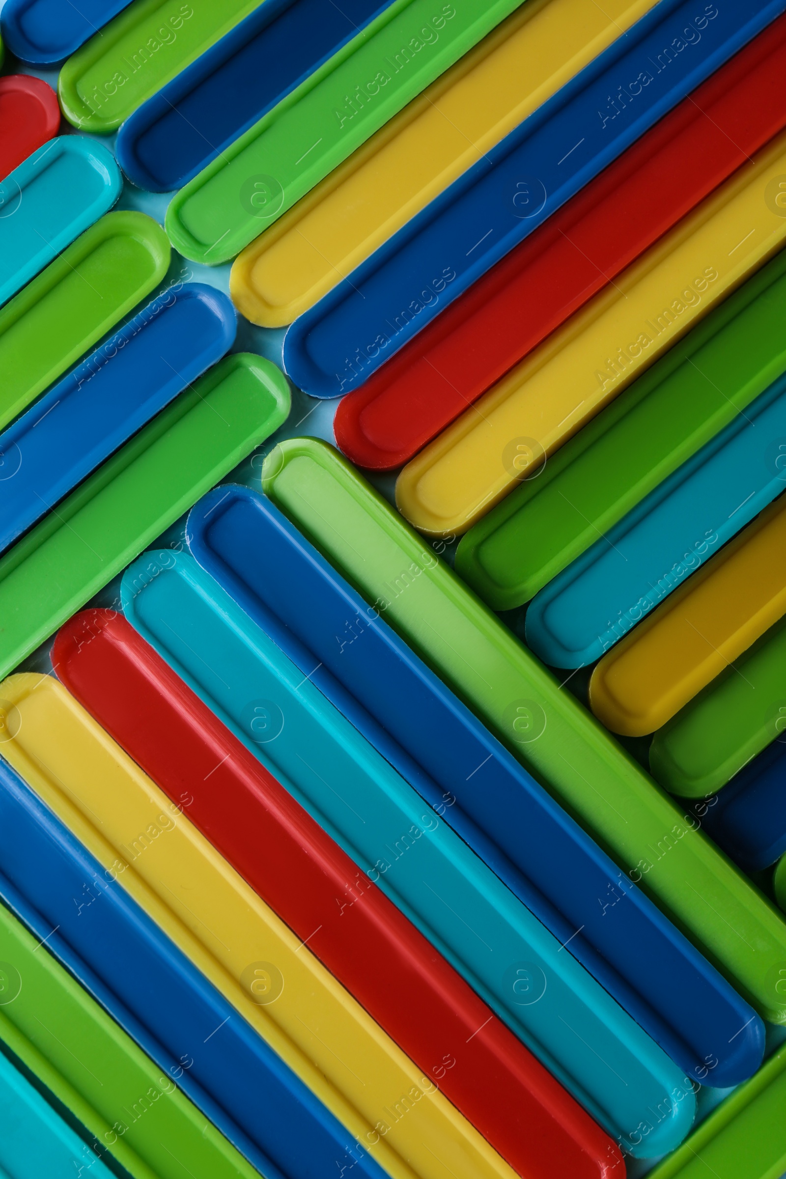 Photo of Many bright counting sticks as background, top view