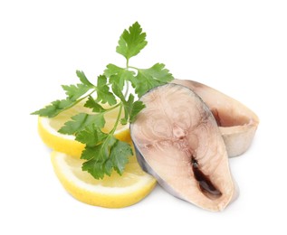 Pieces of mackerel fish with parsley and lemon on white background
