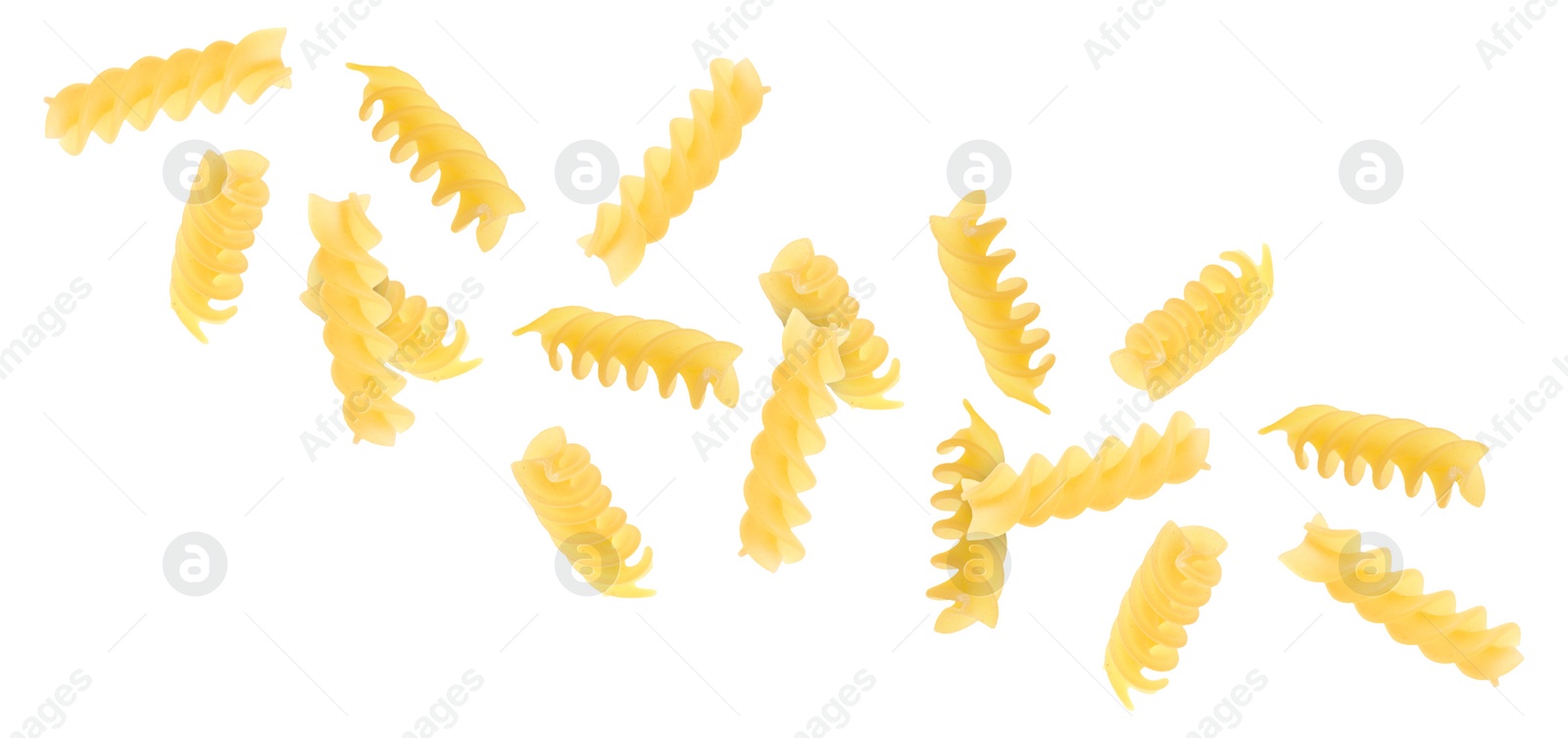 Image of Raw fusilli pasta flying on white background