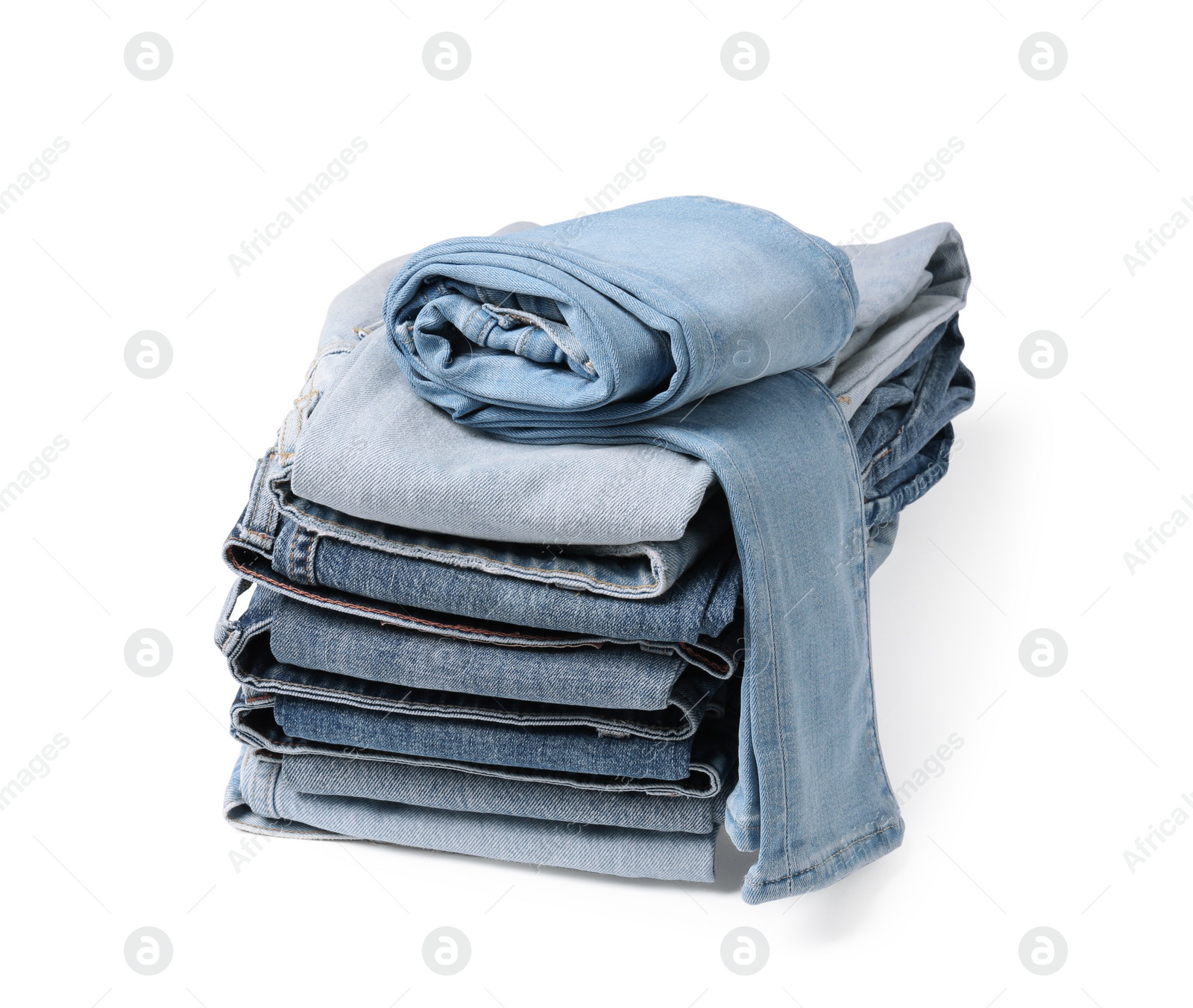 Image of Stack of different folded jeans isolated on white