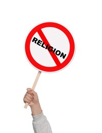 Image of Atheism concept. Woman holding prohibition sign with crossed out word Religion on white background