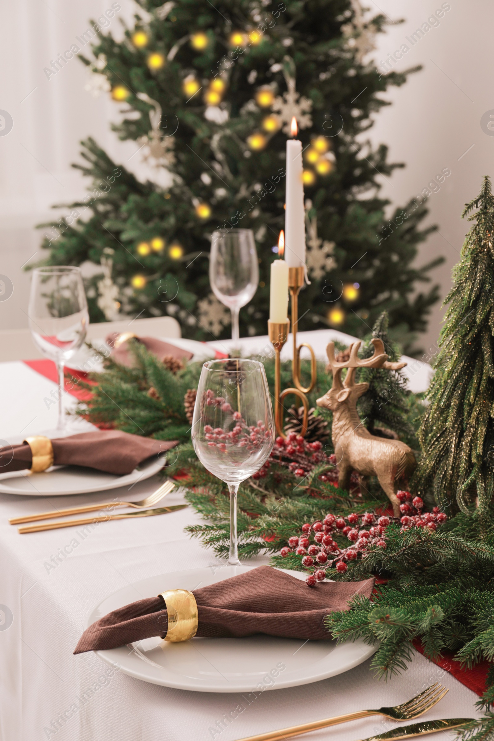 Photo of Beautiful table setting with Christmas decor indoors