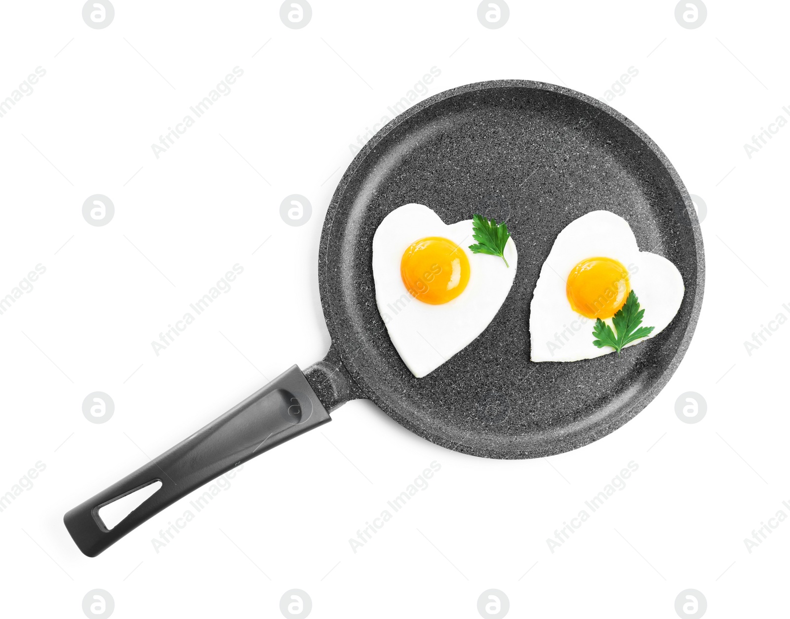 Photo of Romantic breakfast with fried heart shaped eggs isolated on white, top view. Valentine's day celebration