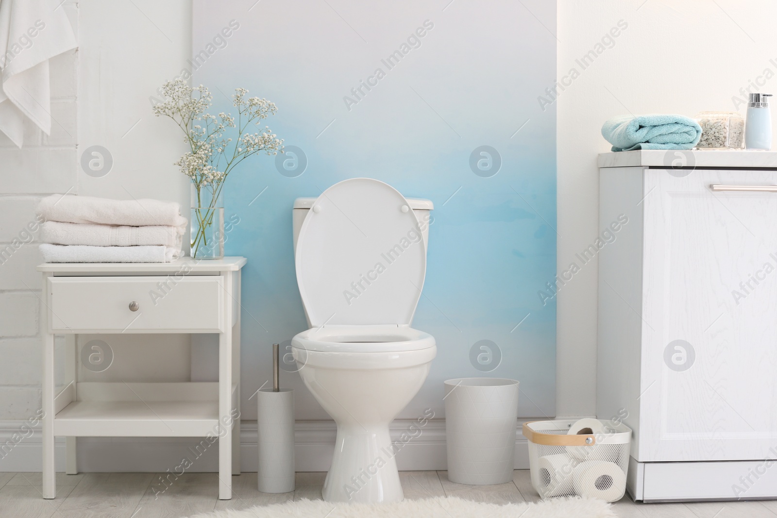 Photo of Modern toilet bowl in stylish bathroom interior