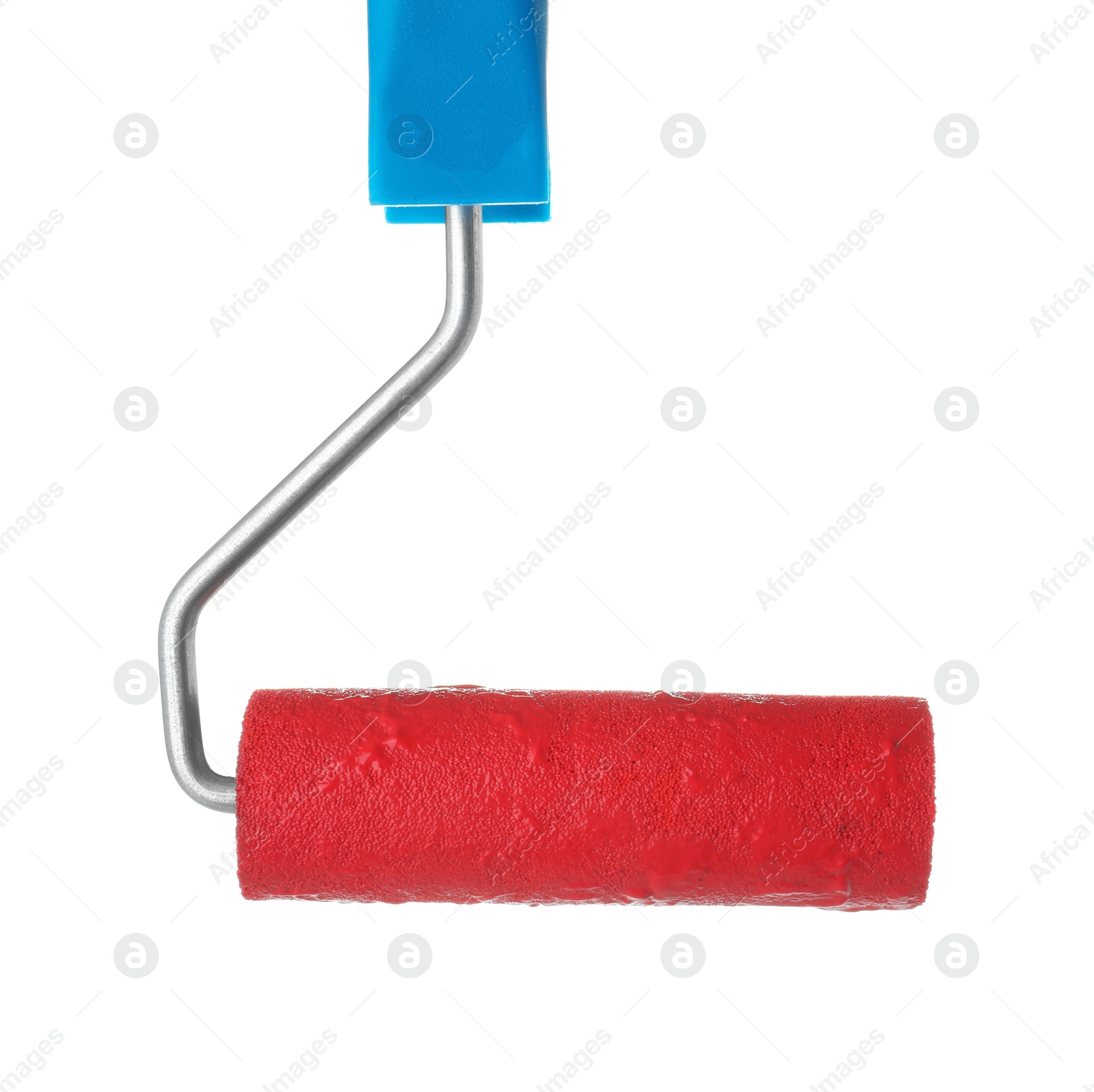 Photo of Roller brush with red paint on white background