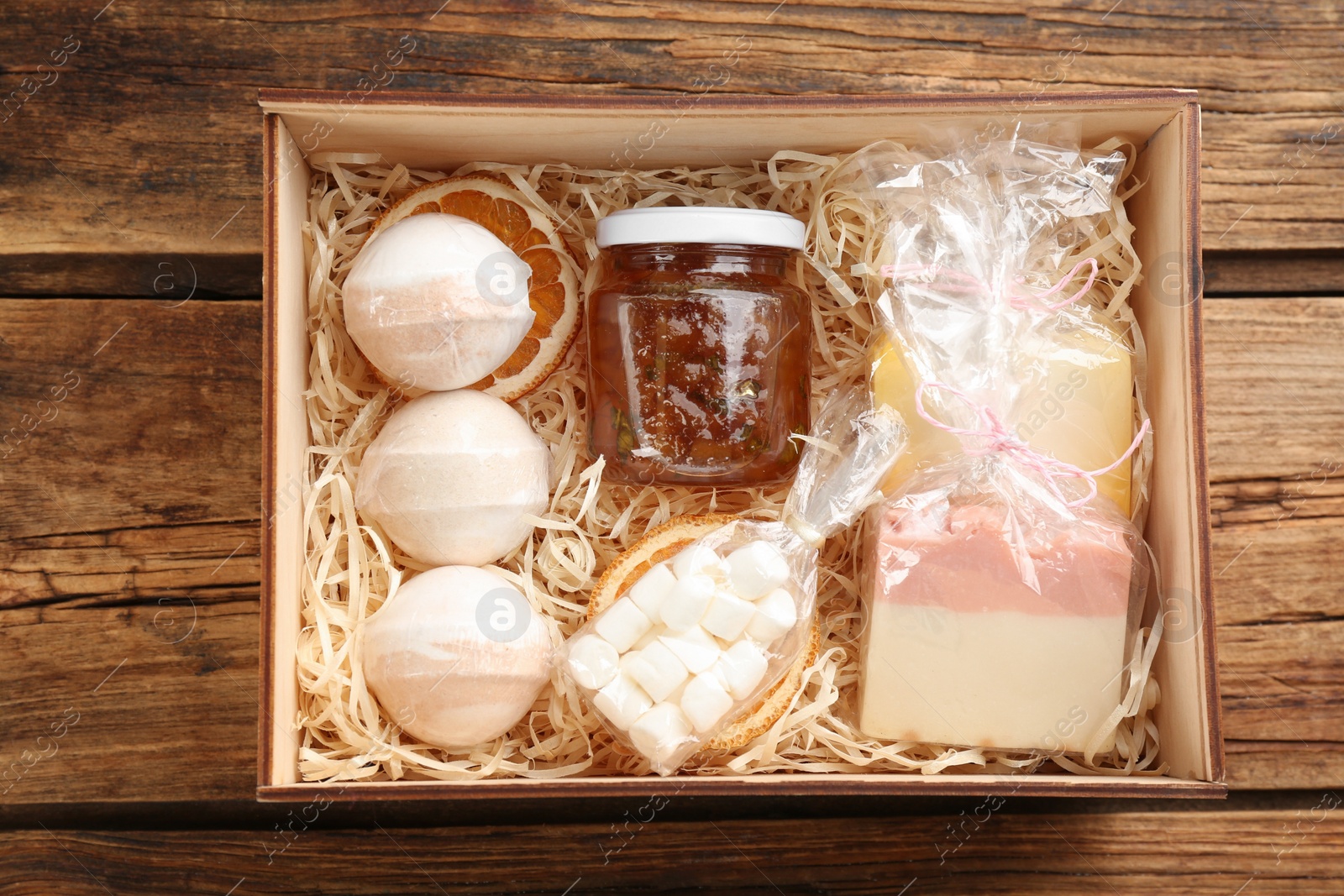 Photo of Box with stylish craft gift set on wooden table, top view