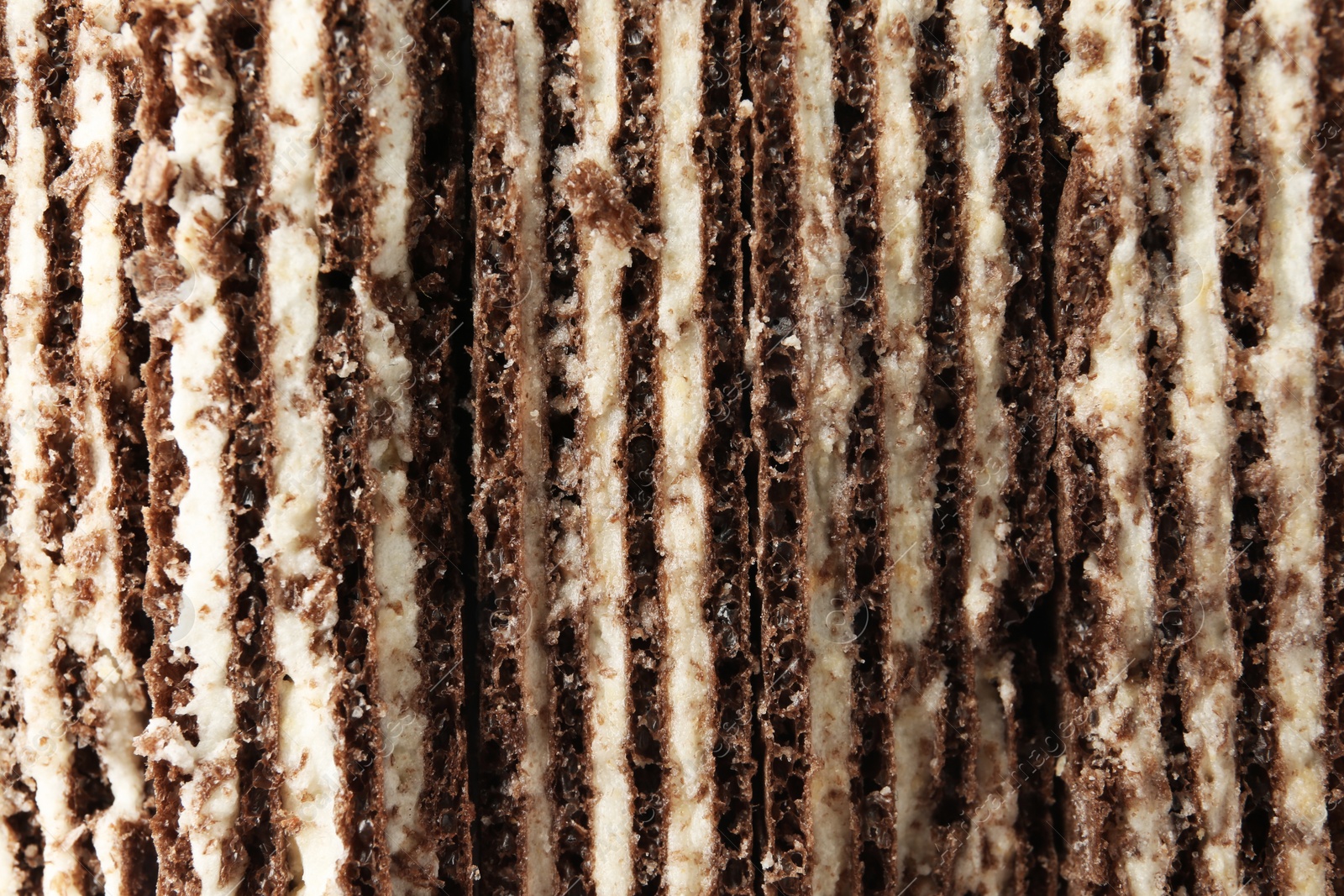 Photo of Closeup view of tasty wafer sticks as background. Sweet food