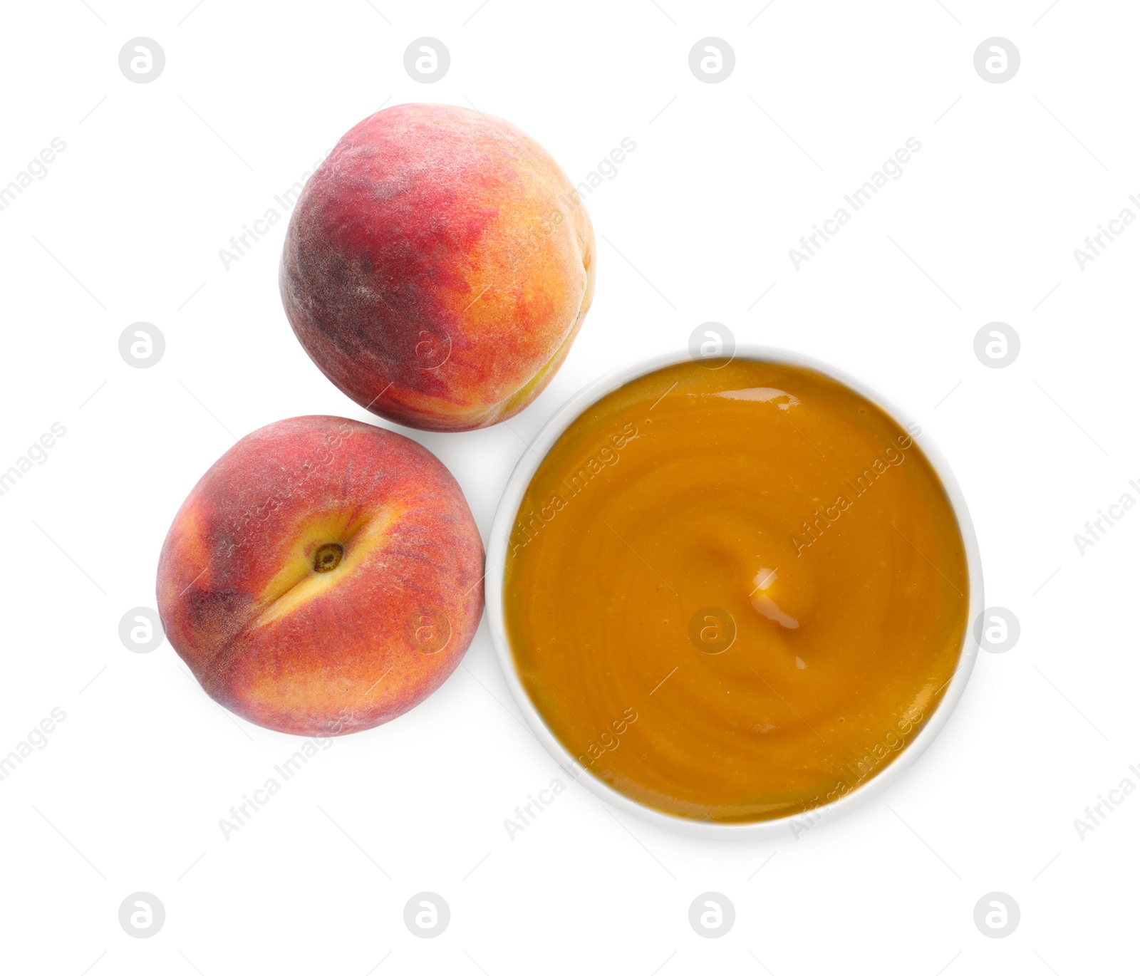 Photo of Peach puree in bowl and fresh fruits on white background, top view