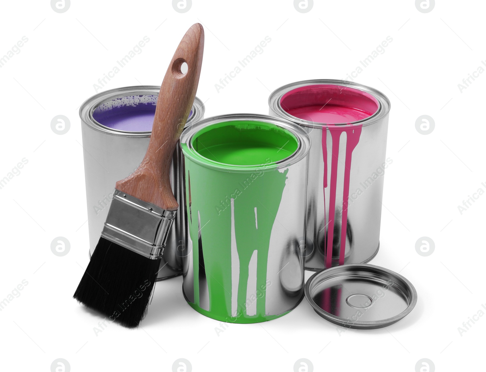 Photo of Cans of colorful paints and brush isolated on white