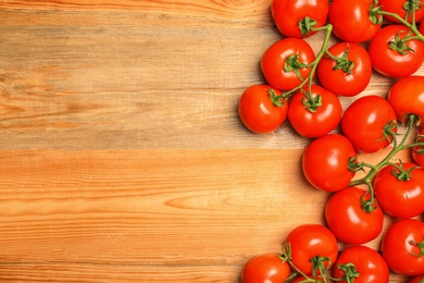 Photo of Flat lay composition with ripe tomatoes on wooden background