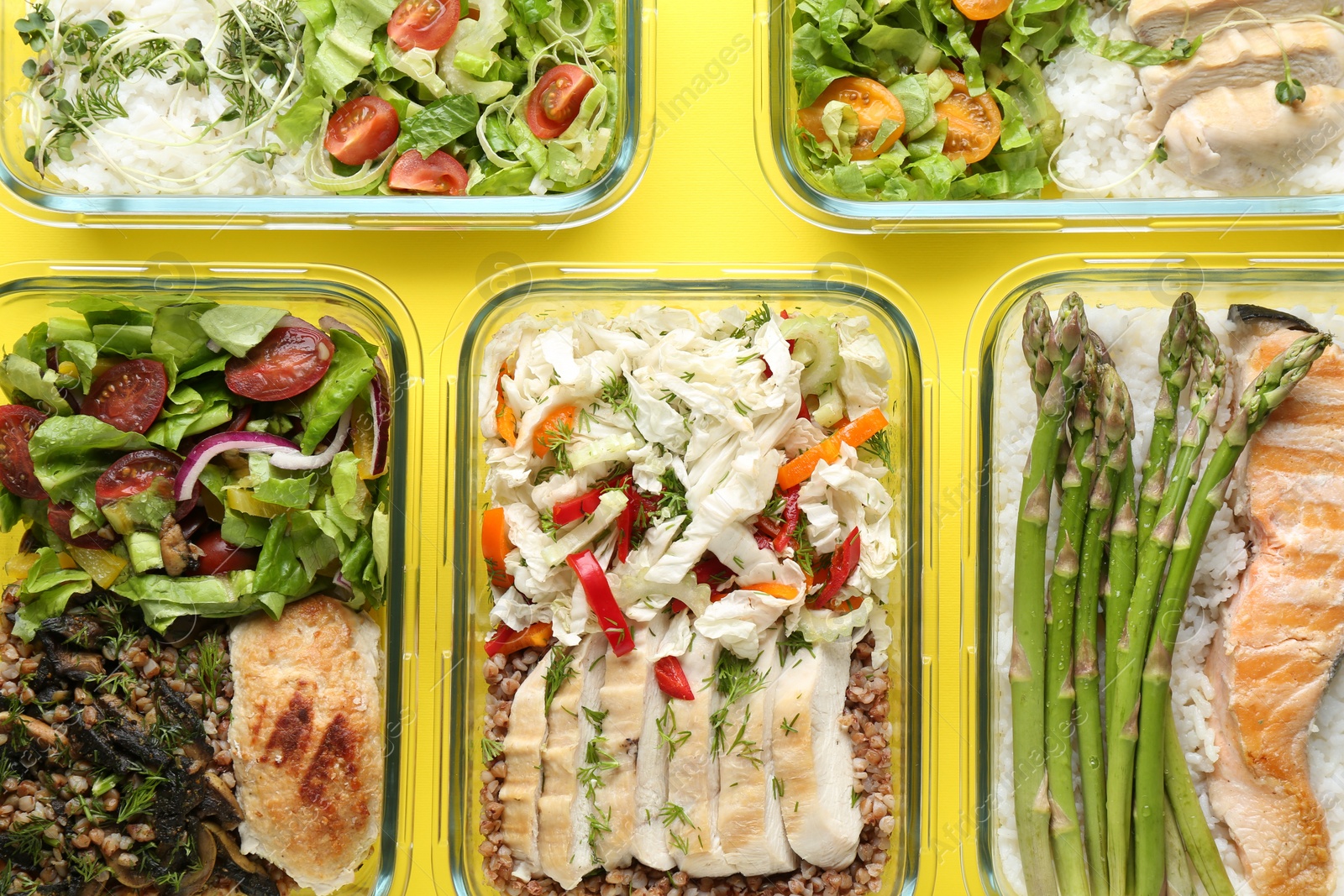 Photo of Healthy food. Different meals in glass containers on yellow background, flat lay