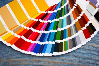 Photo of Color palette samples on wooden background