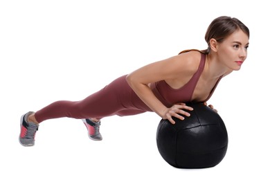 Photo of Athletic woman doing exercise with medicine ball isolated on white