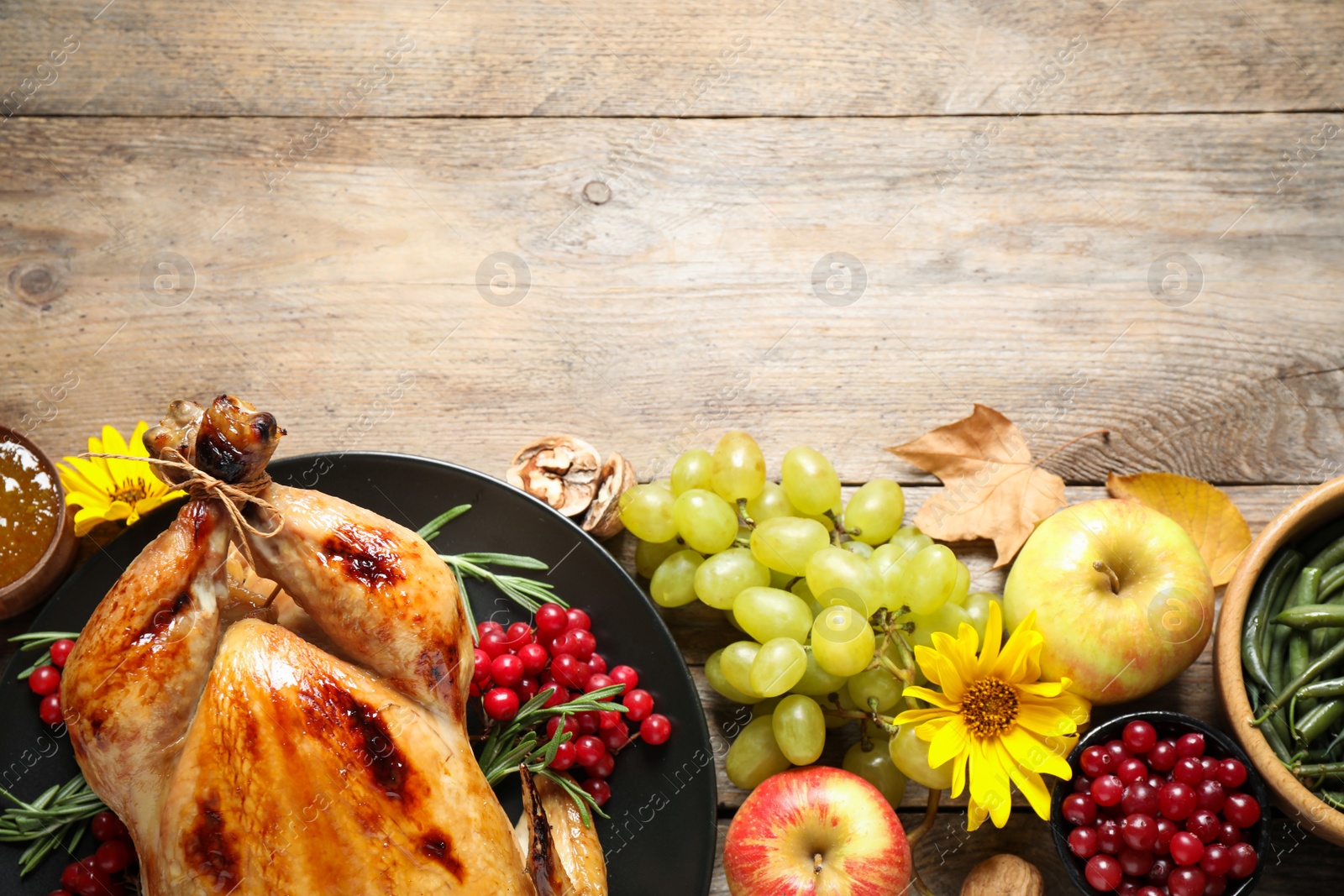 Photo of Flat lay composition with turkey on wooden background, space for text. Happy Thanksgiving day