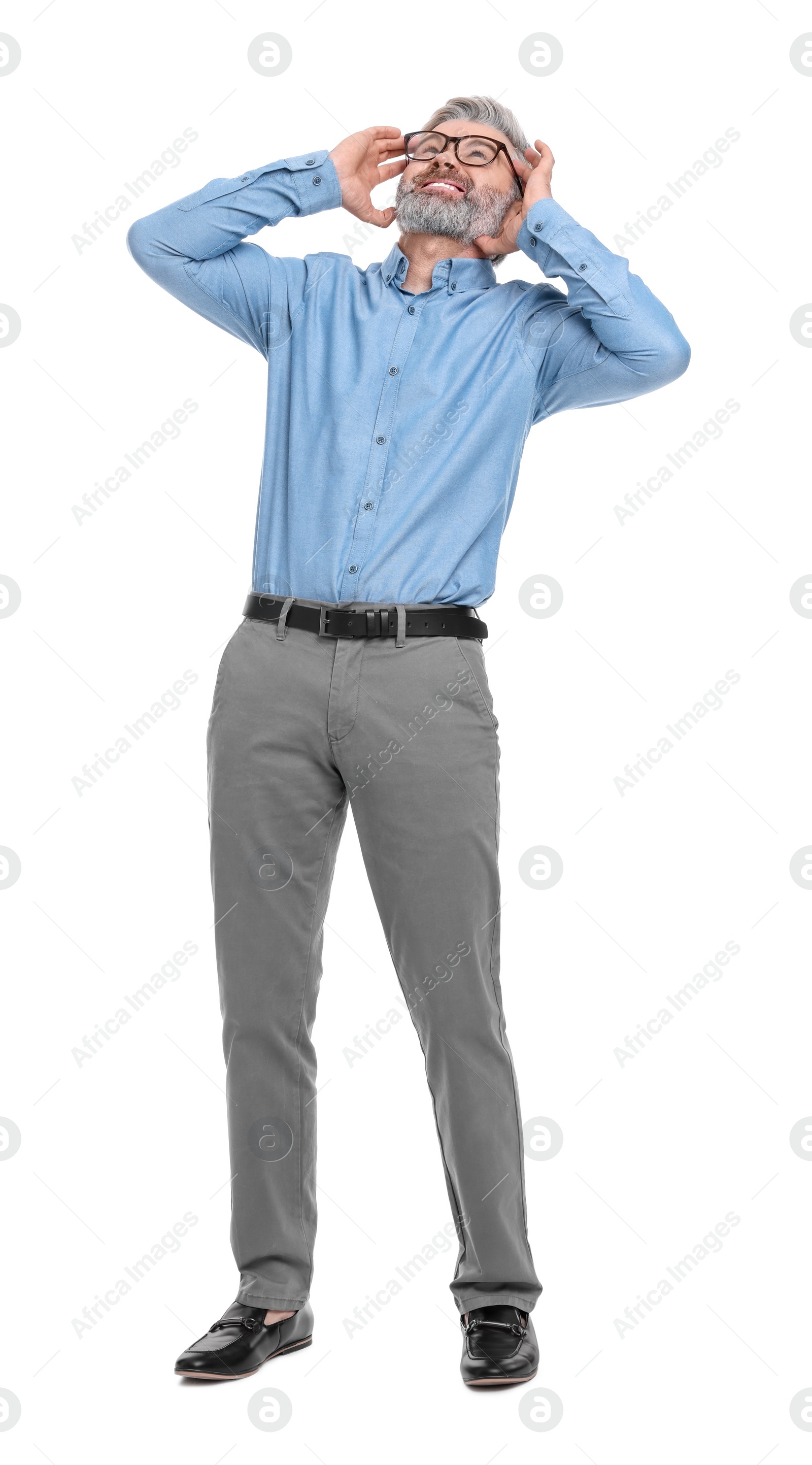 Photo of Mature businessman in stylish clothes posing on white background