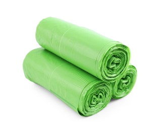 Rolls of light green garbage bags isolated on white