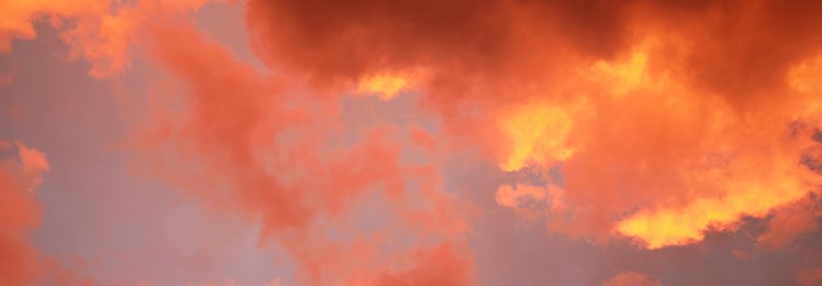 Image of Beautiful cloudy sky at sunset, banner design