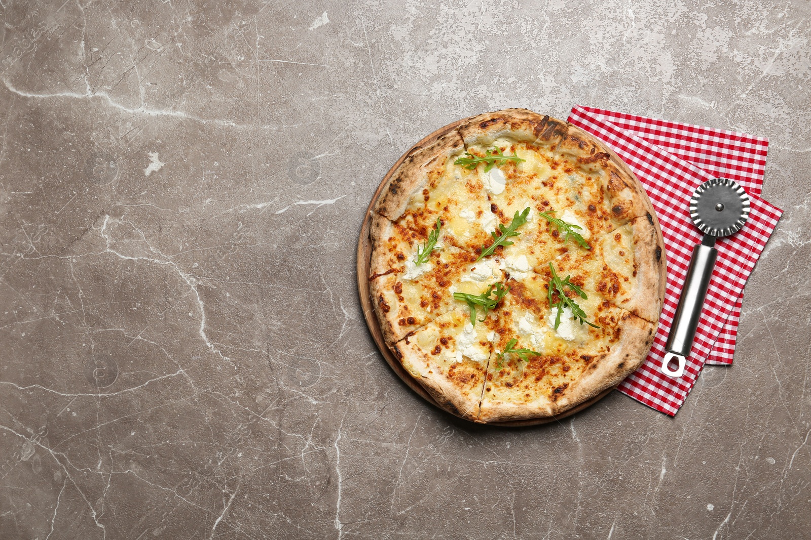 Image of Tasty cheese pizza on grey marble table, top view. Space for text