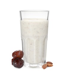 Photo of Glass of delicious date smoothie, dried fruits and nuts on white background