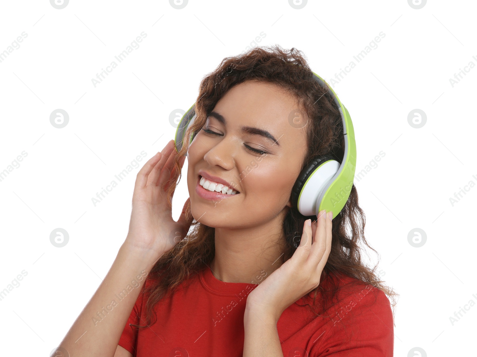 Photo of African-American girl listening to music with headphones on white background