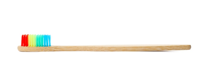 Photo of Toothbrush made of bamboo on white background